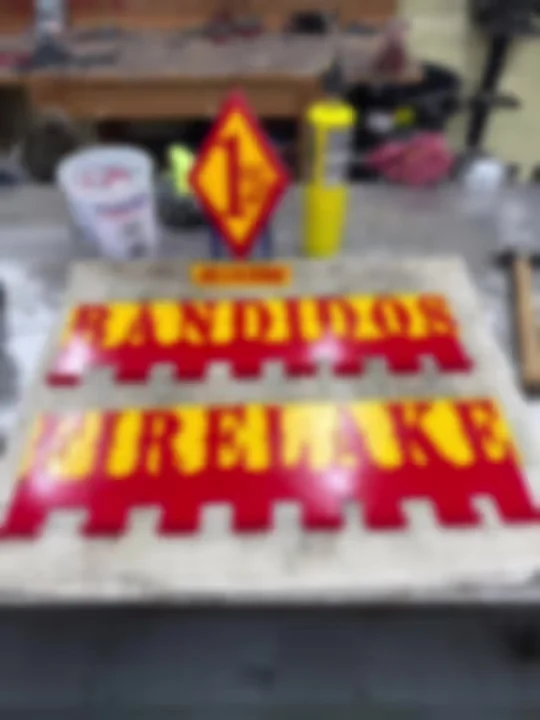 Custom metal signage and hat racks from the shop